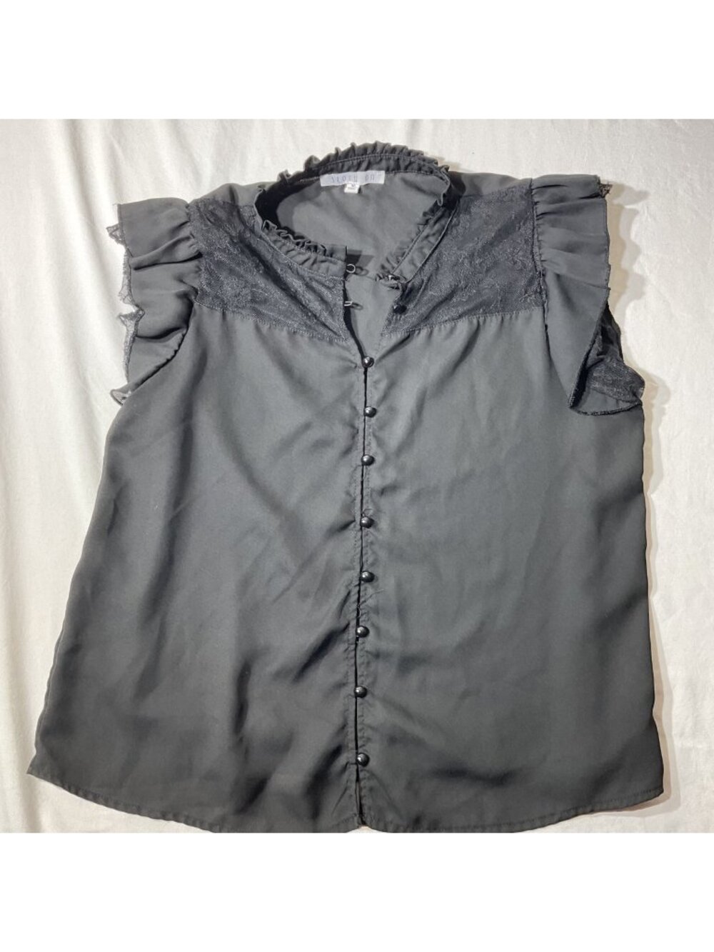 Story On Womens Black Sleeveless Top With Lace Yoke Ruffle Trim And Button Front